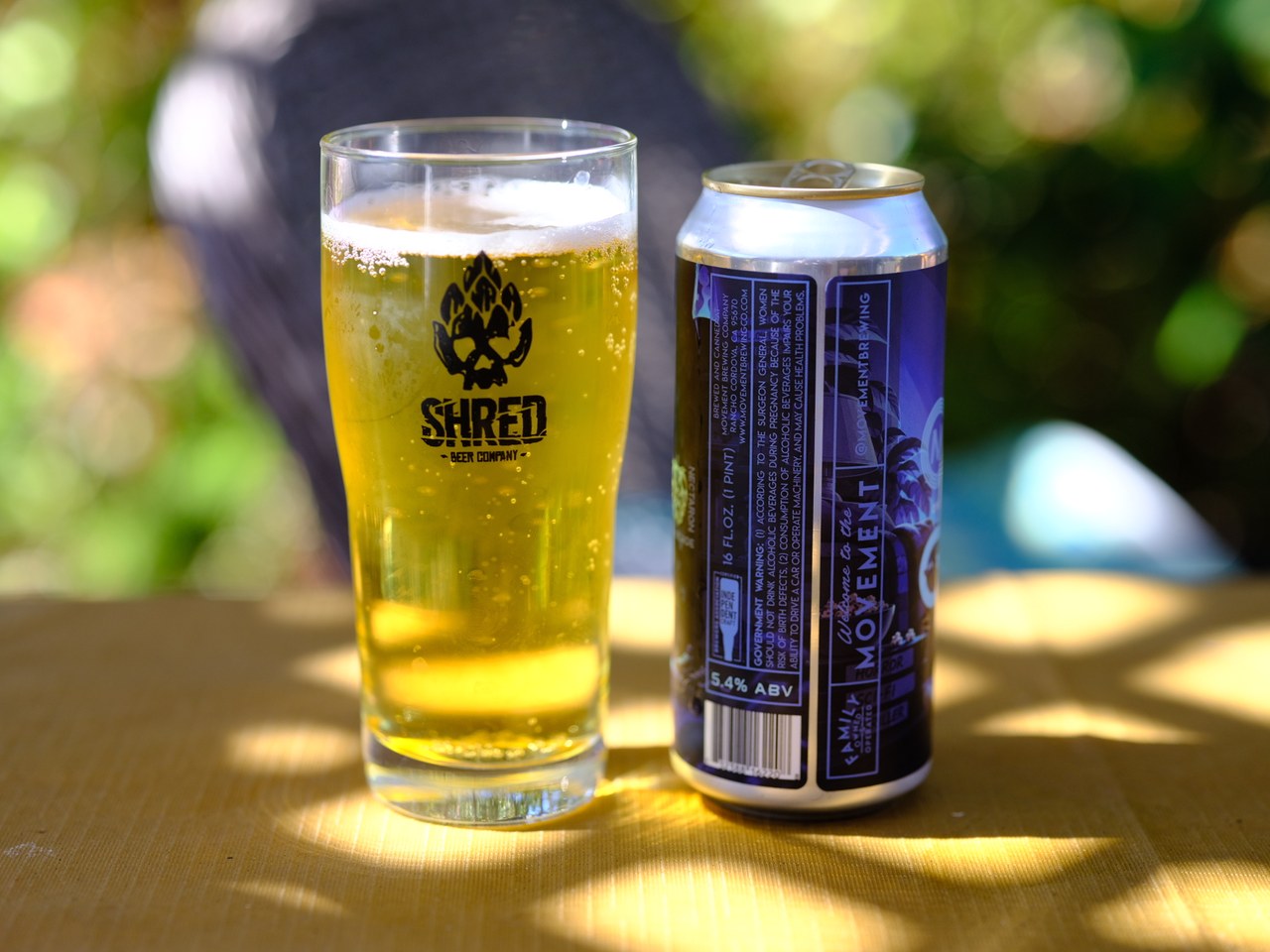 Coldergeist glass and the side of the can showing the 5.4% ABV label